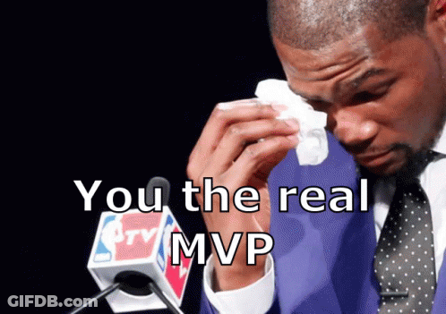 A Man In A Suit And Tie Is Crying In Front Of A Microphone That Says Nba On It GIF