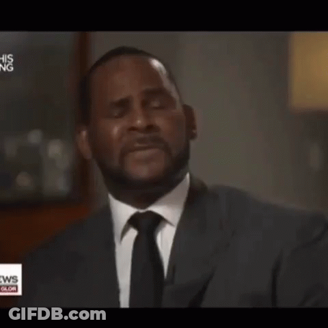 A Man In A Suit And Tie Is Crying In Front Of A News Anchor GIF