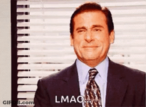 A Man In A Suit And Tie Is Crying While Standing In Front Of A Window With Blinds . GIF