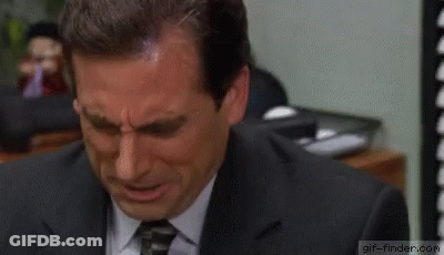 A Man In A Suit And Tie Is Crying With Tears Running Down His Face . GIF