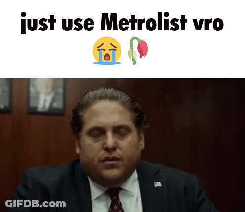 A Man In A Suit And Tie Is Crying With The Words Just Use Metrolist Vro GIF