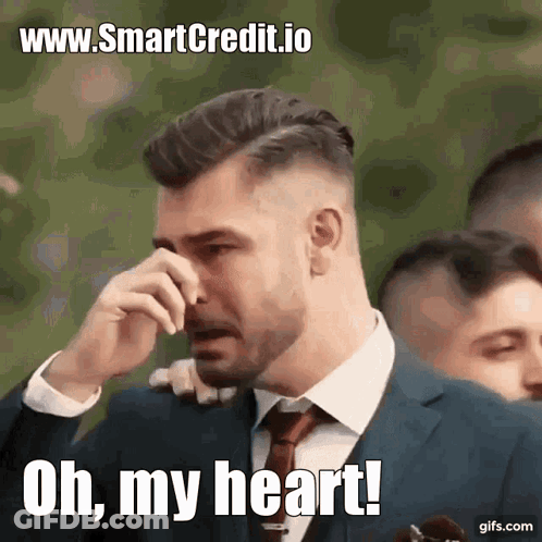 A Man In A Suit And Tie Is Crying With The Words Oh My Heart Written Below Him GIF