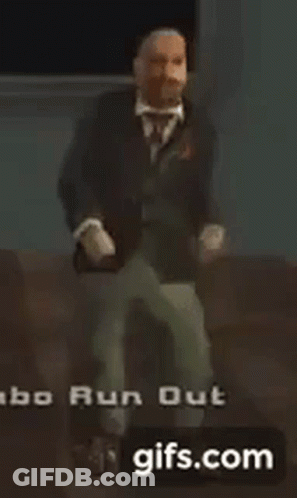 A Man In A Suit And Tie Is Dancing In A Video Game GIF