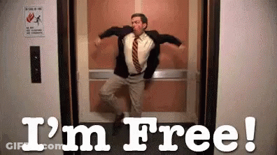 A Man In A Suit And Tie Is Dancing In An Elevator With The Words `` I 'M Free '' . GIF