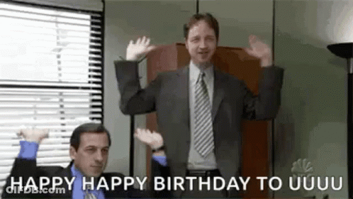 A Man In A Suit And Tie Is Dancing In An Office While Another Man Says `` Happy Happy Birthday To Uuuu '' . GIF