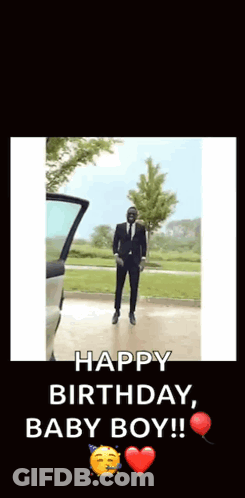 A Man In A Suit And Tie Is Dancing In Front Of A Car With The Words Happy Birthday Baby Boy GIF