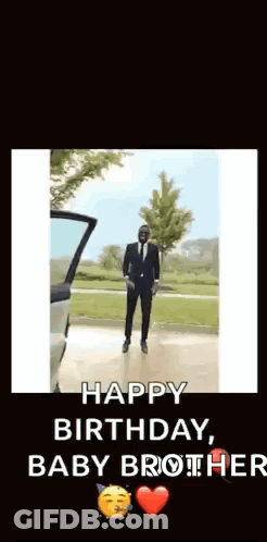 A Man In A Suit And Tie Is Dancing In Front Of A Car With The Words Happy Birthday Baby Brother . GIF