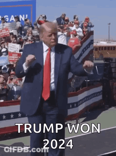 A Man In A Suit And Tie Is Dancing In Front Of A Crowd And Says Trump Won 2024 On The Bottom GIF