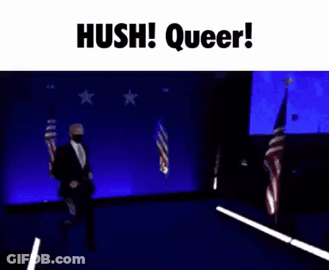 A Man In A Suit And Tie Is Dancing On A Stage In Front Of A Blue Background . GIF