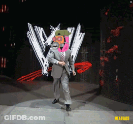A Man In A Suit And Tie Is Dancing On A Stage In Front Of A W Logo GIF