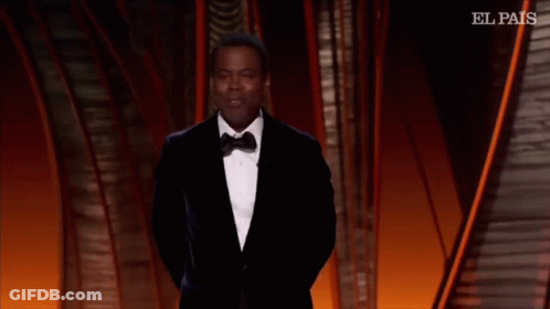 A Man In A Suit And Tie Is Dancing On A Stage With El Pais Written On The Bottom GIF