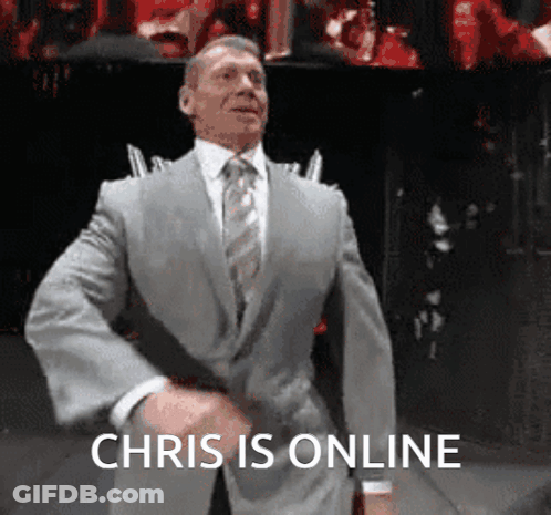A Man In A Suit And Tie Is Dancing With The Words Chris Is Online Below Him GIF