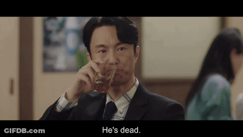 A Man In A Suit And Tie Is Drinking A Glass Of Whiskey And Says He 'S Dead . GIF