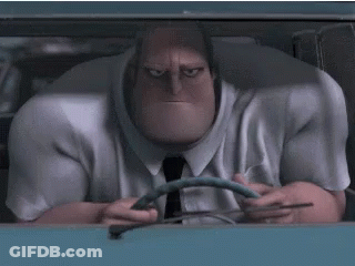 A Man In A Suit And Tie Is Driving A Car And Holding A Steering Wheel . GIF