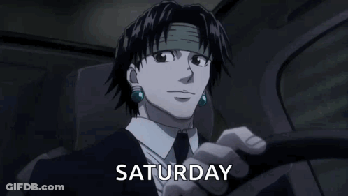 A Man In A Suit And Tie Is Driving A Car And The Word Saturday Is On The Screen Behind Him . GIF