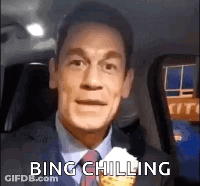 A Man In A Suit And Tie Is Eating An Ice Cream Cone And Saying Bing Chilling . GIF
