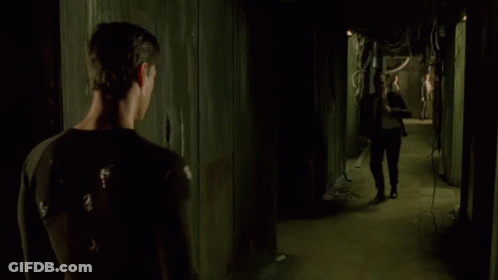 A Man In A Suit And Tie Is Fighting Another Man GIF