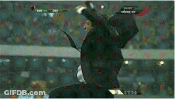 A Man In A Suit And Tie Is Flying Through The Air GIF