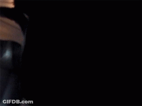 A Man In A Suit And Tie Is Flying Through The Air On An Airplane GIF