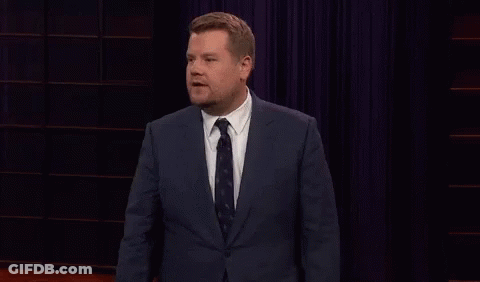 A Man In A Suit And Tie Is Giving A Speech GIF