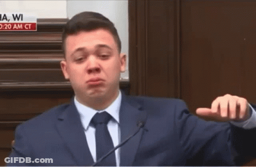 A Man In A Suit And Tie Is Giving A Speech GIF