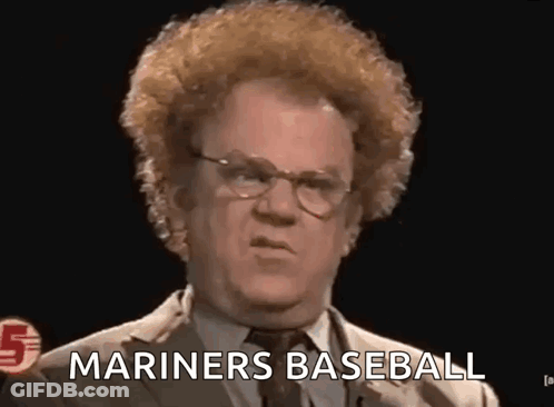 A Man In A Suit And Tie Is Giving A Speech And Saying `` Mariners Baseball '' . GIF