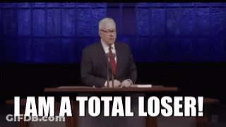 A Man In A Suit And Tie Is Giving A Speech At A Podium And Saying `` I Am A Total Loser '' GIF