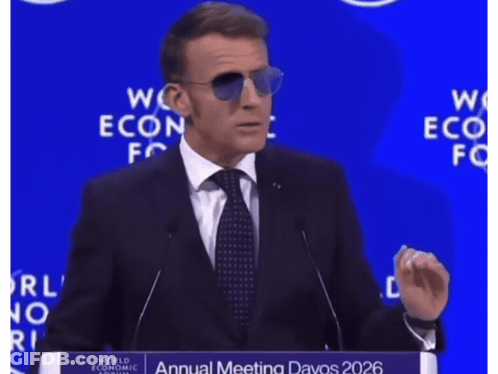 A Man In A Suit And Tie Is Giving A Speech At The World Economic Forum Annual Meeting GIF