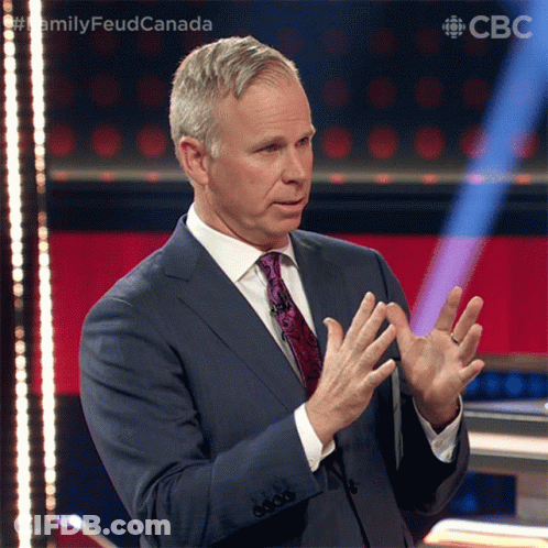 A Man In A Suit And Tie Is Giving A Speech In Front Of A Cbc Logo GIF