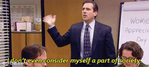 A Man In A Suit And Tie Is Giving A Speech In Front Of A Whiteboard . GIF