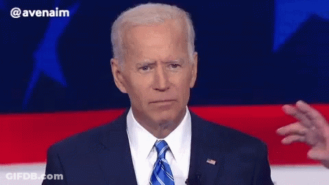 Man In Suit Giving Speech In Front Of American Flag GIF