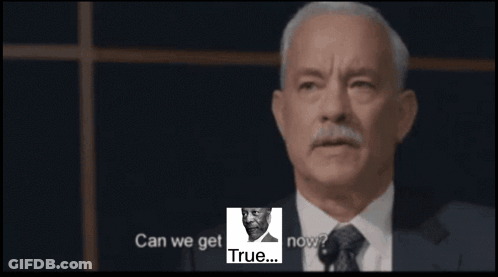 A Man In A Suit And Tie Is Giving A Speech With The Words " Can We Get Now " In The Corner GIF