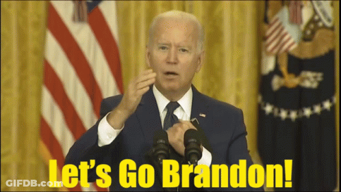A Man In A Suit And Tie Is Giving A Speech With The Words Let 'S Go Brandon On The Bottom GIF
