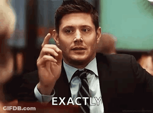 A Man In A Suit And Tie Is Giving A Thumbs Up And Saying `` Exactly '' . GIF