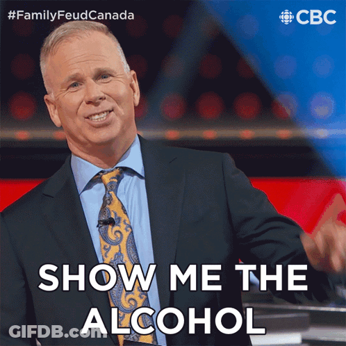 A Man In A Suit And Tie Is Giving A Thumbs Up And Says Show Me The Alcohol GIF