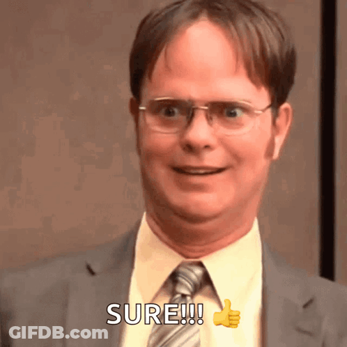 A Man In A Suit And Tie Is Giving A Thumbs Up And Says Sure GIF