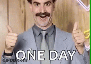 A Man In A Suit And Tie Is Giving A Thumbs Up And The Words `` One Day '' Behind Him . GIF