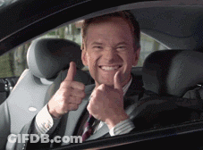 A Man In A Suit And Tie Is Giving A Thumbs Up Sign GIF