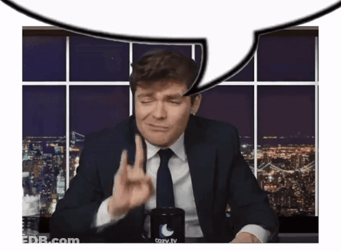 A Man In A Suit And Tie Is Giving The Middle Finger In Front Of A Cozy Tv Mug GIF