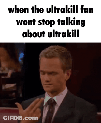 A Man In A Suit And Tie Is Giving The Middle Finger To Someone . GIF