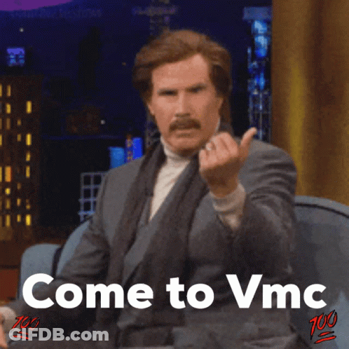A Man In A Suit And Tie Is Giving The Middle Finger With The Words Come To Vmc Below Him GIF