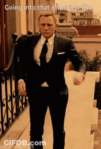 A Man In A Suit And Tie Is Going Into A Job Interview GIF