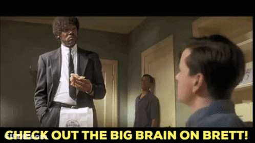 A Man In A Suit And Tie Is Holding A Bag Of Cereal And Talking To Another Man With The Words Check Out The Big Brain GIF