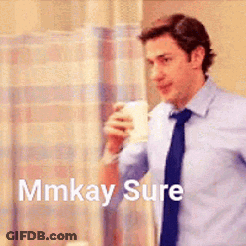 A Man In A Suit And Tie Is Holding A Cup Of Coffee And Says `` Mmkay Sure '' . GIF
