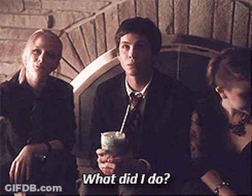 A Man In A Suit And Tie Is Holding A Drink In His Hand And Asking What Did I Do GIF