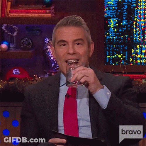 Man In Suit And Tie Holding Glass And Clipboard Bravo GIF