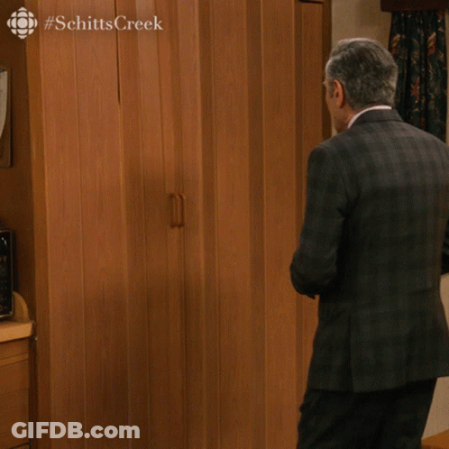 A Man In A Suit And Tie Is Holding A Glass Of Champagne And Says " Nothing To See Here People " In The Corner GIF