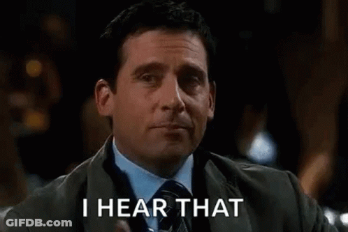 A Man In A Suit And Tie Is Holding A Glass Of Whiskey And Says `` I Hear That '' . GIF