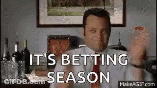 A Man In A Suit And Tie Is Holding A Glass Of Wine And Saying `` It 'S Betting Season '' GIF