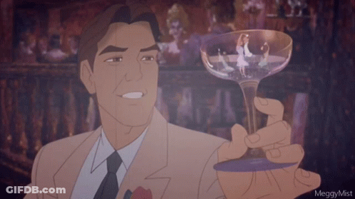 A Man In A Suit And Tie Is Holding A Glass With A Picture Of A Woman In It GIF